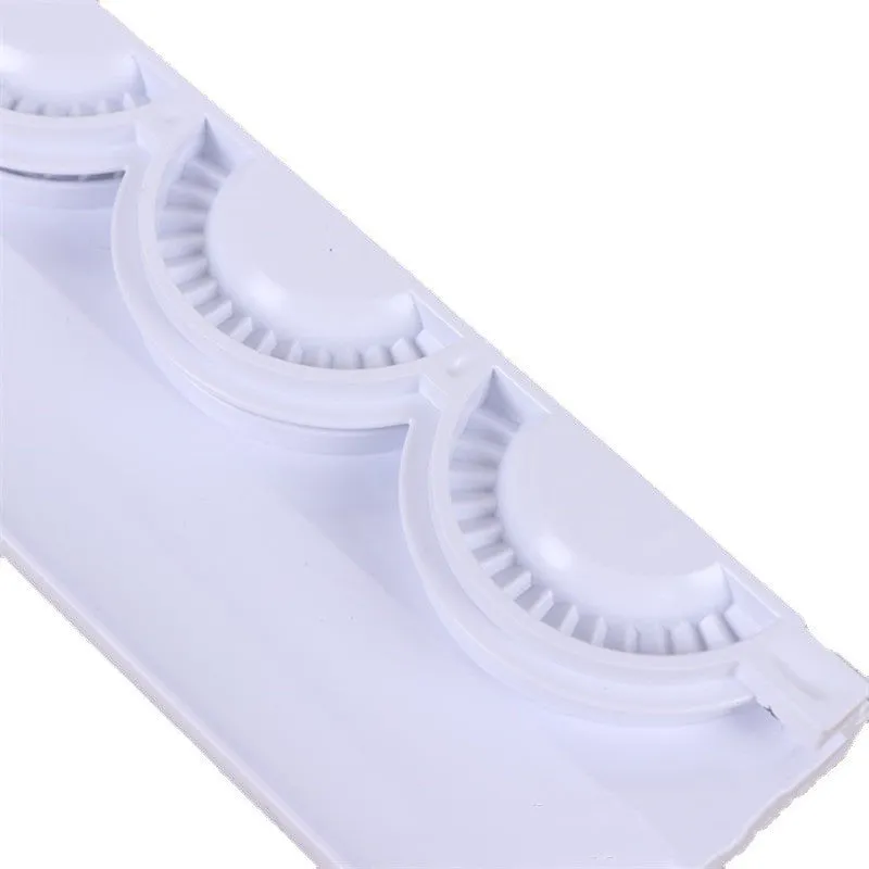 Pure white ABS plastic dumpling maker on a kitchen counter, compact design, modern simple style