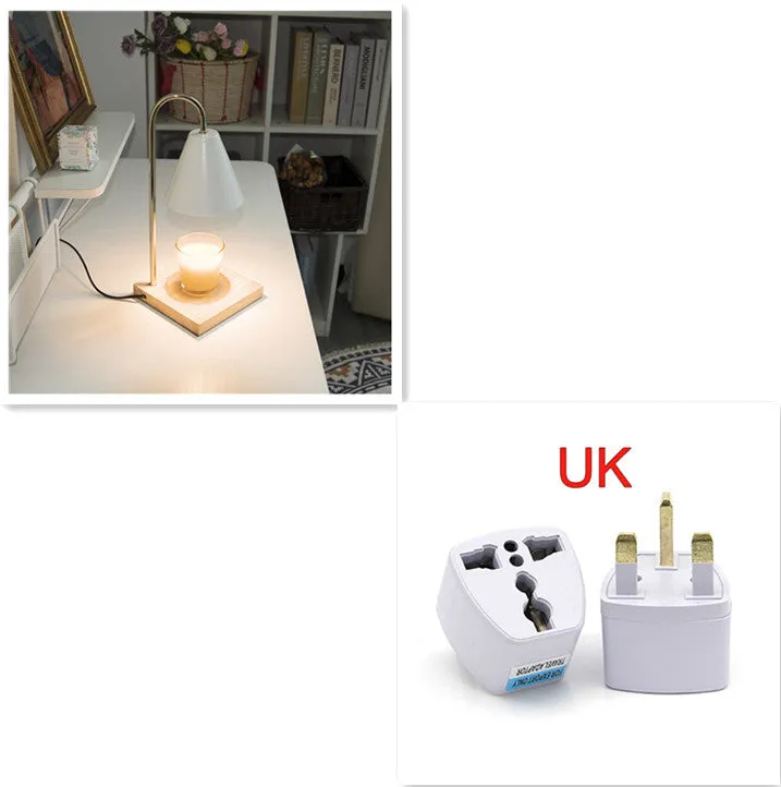 White and log coloured electric candle warmer lamp with dimmer switch on desk