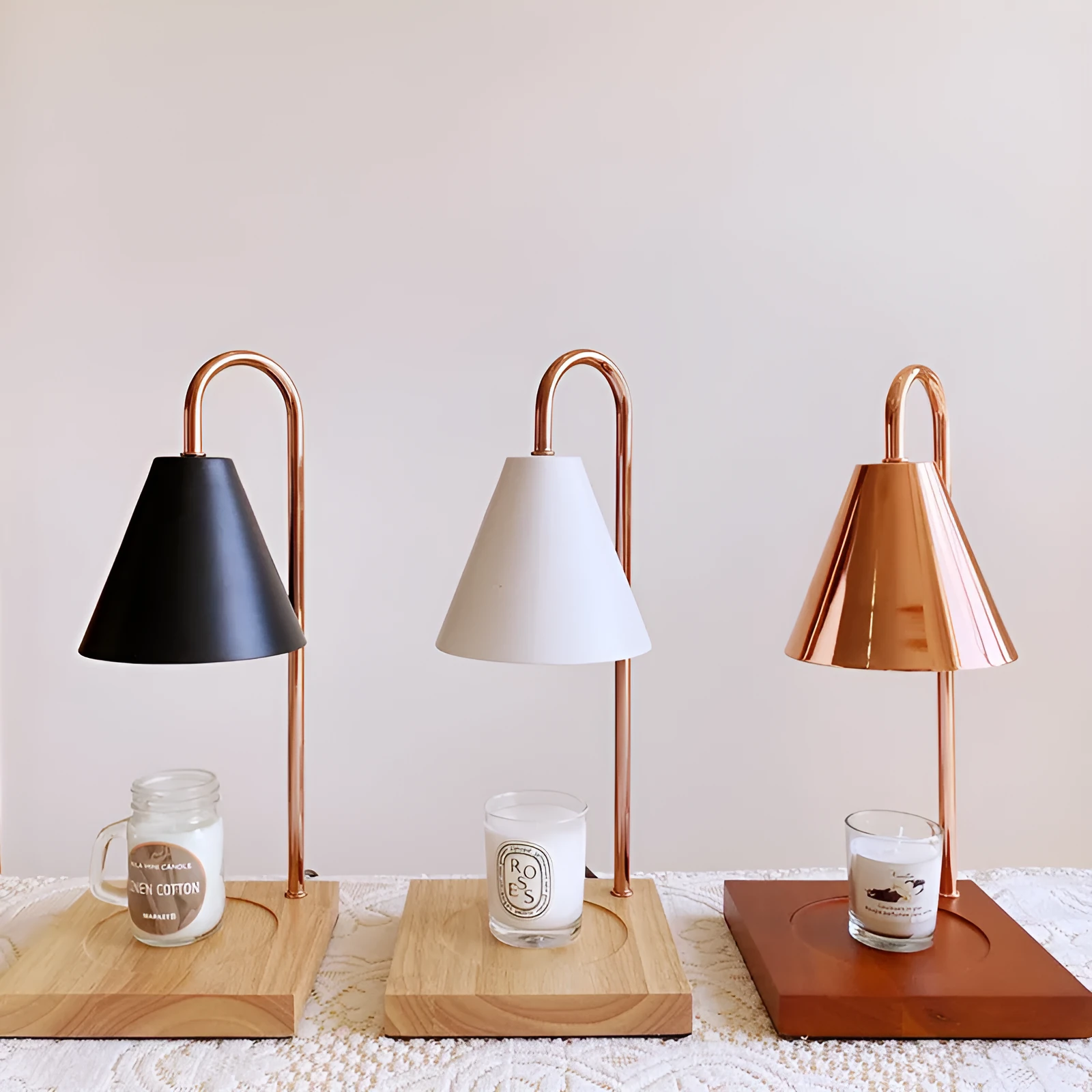 White and log coloured electric candle warmer lamp with dimmer switch on desk