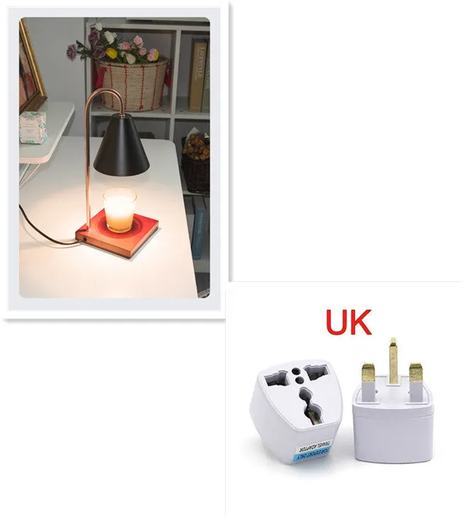 White and log coloured electric candle warmer lamp with dimmer switch on desk