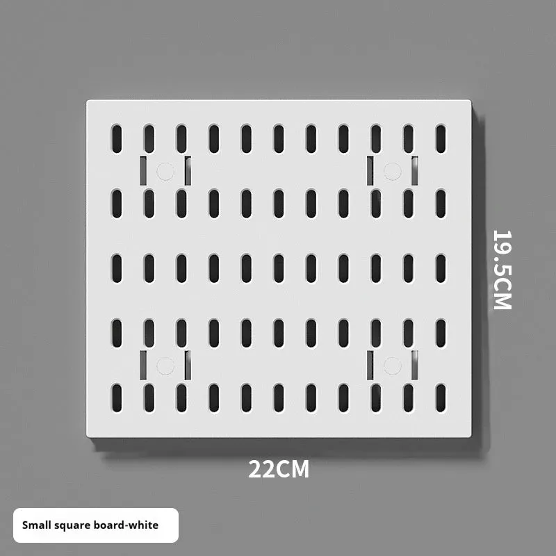 White punch-free plastic cable organisation board mounted on a wall with wires neatly wrapped.