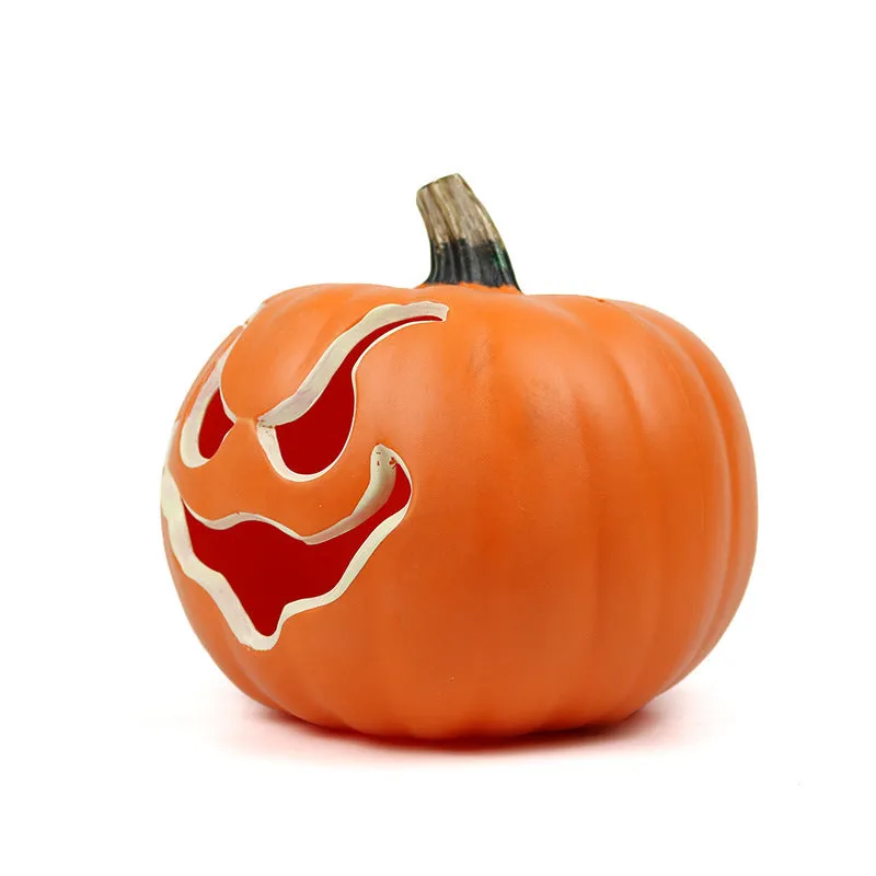 Orange plastic pumpkin-shaped atmosphere light on a dark surface, 23 cm size