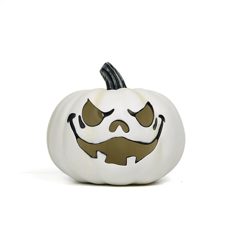 Orange plastic pumpkin-shaped atmosphere light on a dark surface, 23 cm size