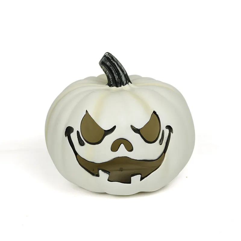 Orange plastic pumpkin-shaped atmosphere light on a dark surface, 23 cm size
