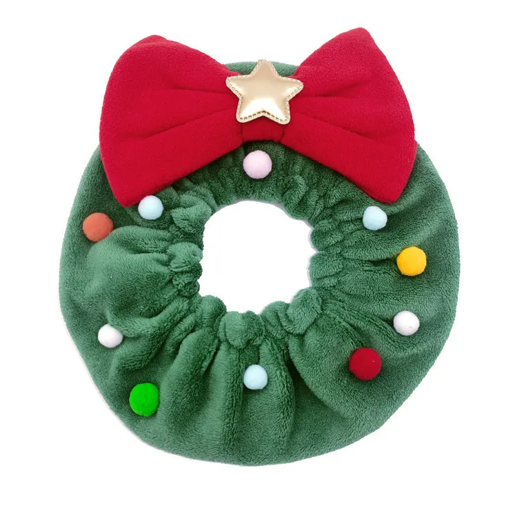 Green Christmas pet bow-knot collar with colourful fuzzy balls on a cat or dog for festive photo props