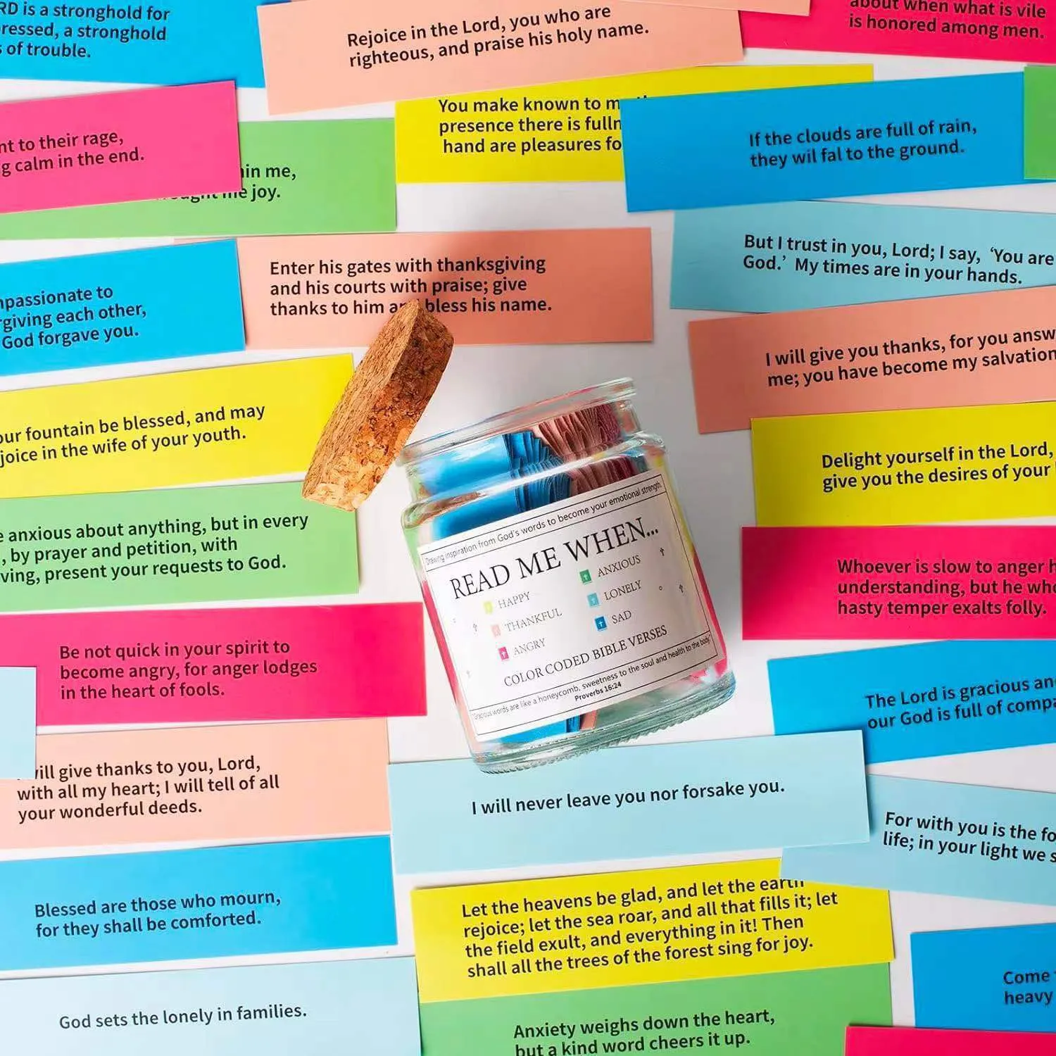 Glass Bible verses jar with cartoon style containing 90 scripture slips on a table