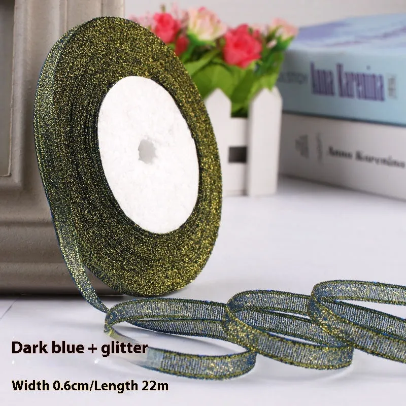 Roll of narrow 0.6cm wide polyester gift ribbon in a multicolour pattern.