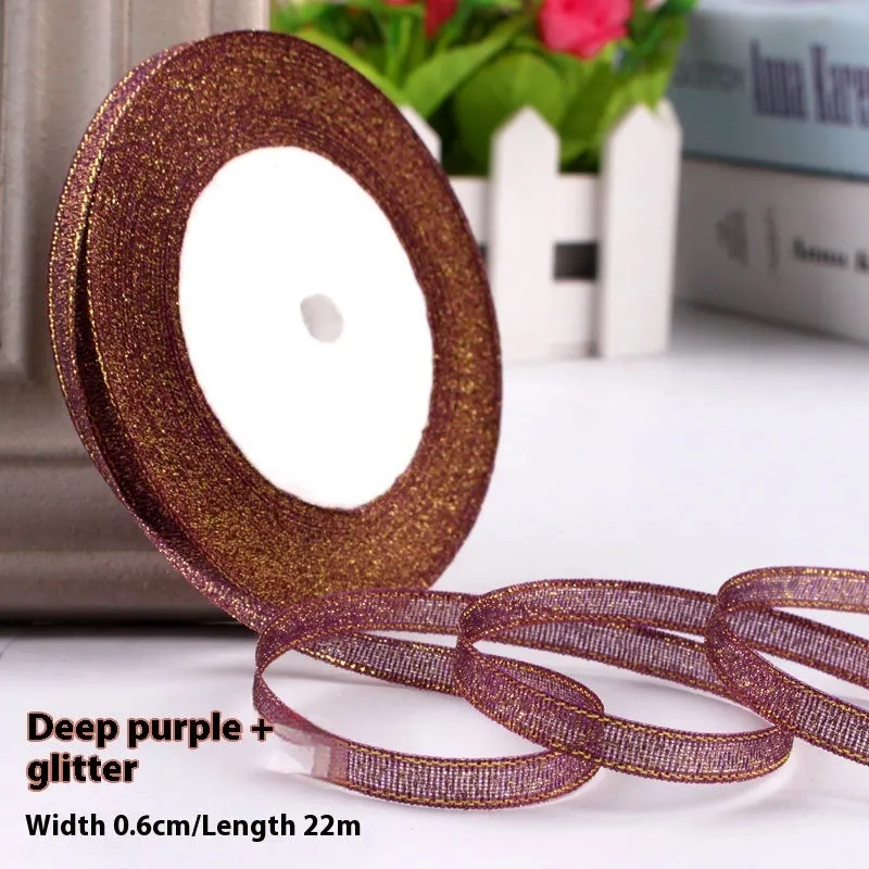 Roll of narrow 0.6cm wide polyester gift ribbon in a multicolour pattern.