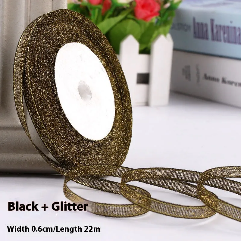Roll of narrow 0.6cm wide polyester gift ribbon in a multicolour pattern.