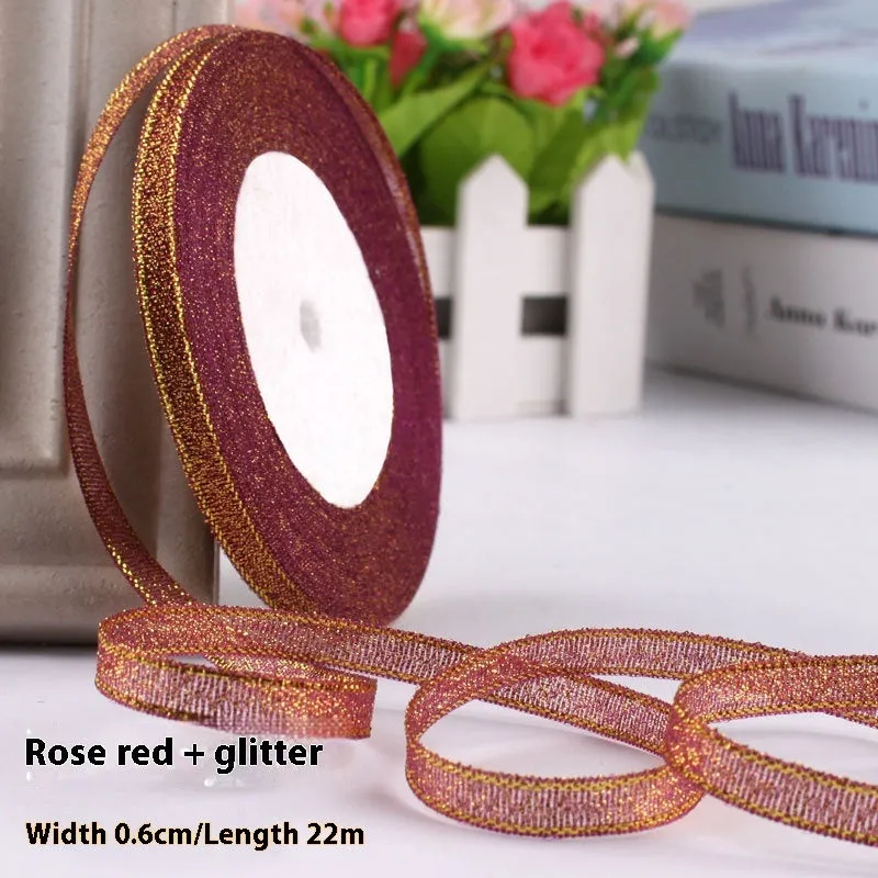 Roll of narrow 0.6cm wide polyester gift ribbon in a multicolour pattern.
