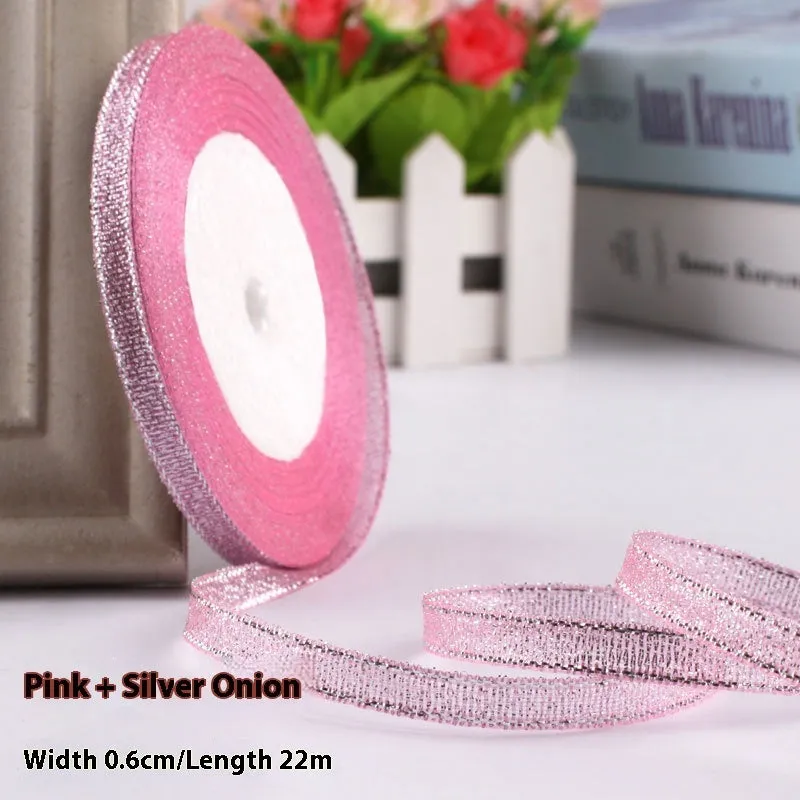 Roll of narrow 0.6cm wide polyester gift ribbon in a multicolour pattern.