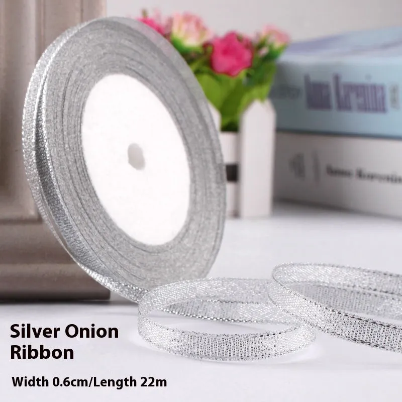 Roll of narrow 0.6cm wide polyester gift ribbon in a multicolour pattern.