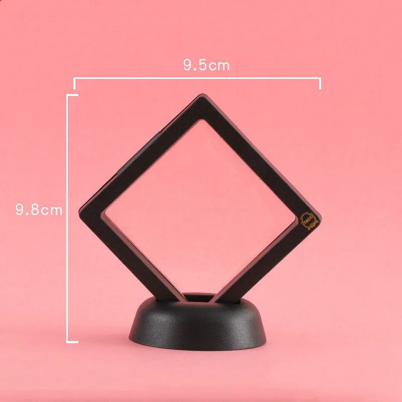 3D floating display case holding coins and jewellery between transparent membrane sheets