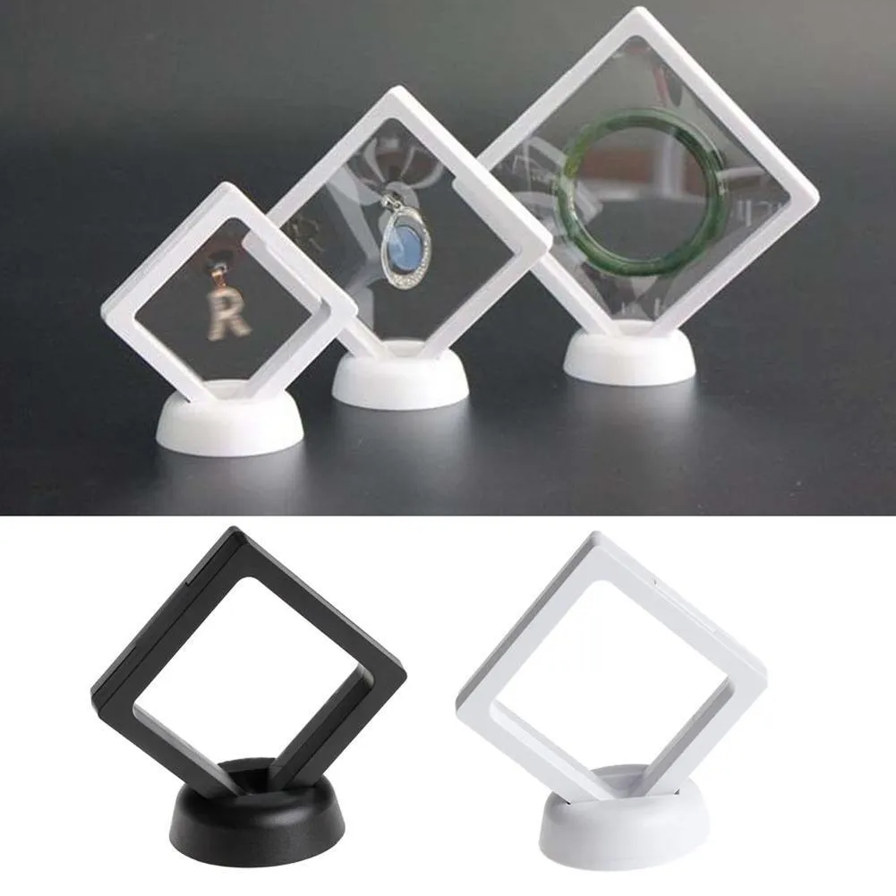 3D floating display case holding coins and jewellery between transparent membrane sheets