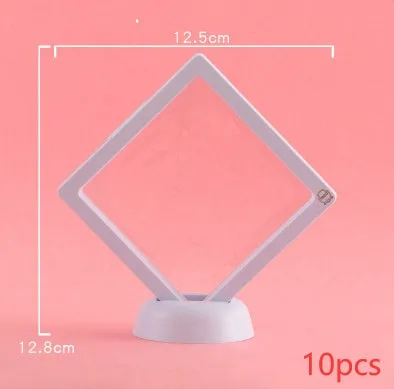 3D floating display case holding coins and jewellery between transparent membrane sheets