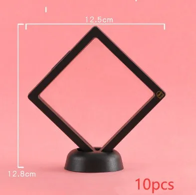 3D floating display case holding coins and jewellery between transparent membrane sheets
