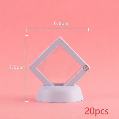 3D floating display case holding coins and jewellery between transparent membrane sheets