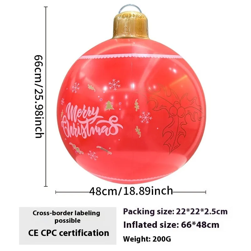 Large red and white inflatable Christmas ball with flashing lights in a garden setting