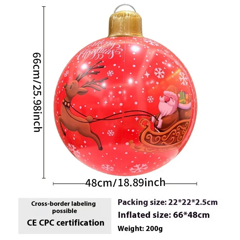 Large red and white inflatable Christmas ball with flashing lights in a garden setting