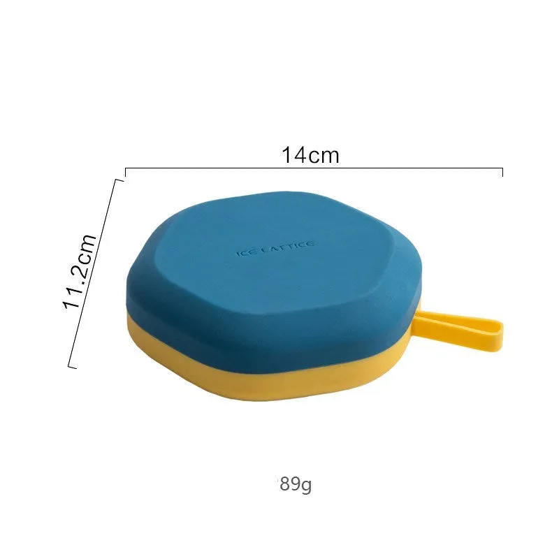 Silicone 12 cavity hexagon ice cube tray with silicone cover in blue, on a countertop