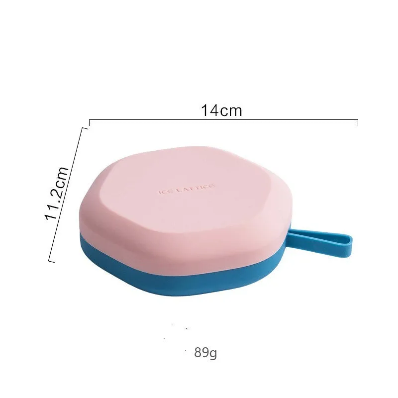 Silicone 12 cavity hexagon ice cube tray with silicone cover in blue, on a countertop