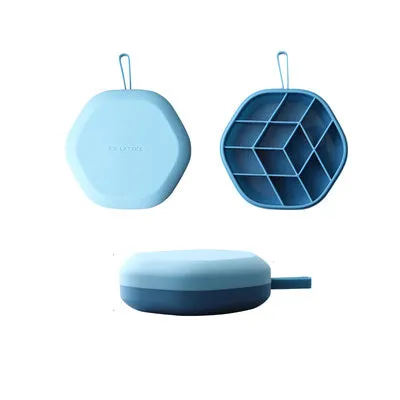 Silicone 12 cavity hexagon ice cube tray with silicone cover in blue, on a countertop