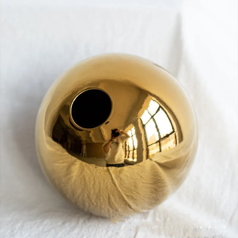 Handmade spherical electroplated ceramic gold vase on a tabletop, three sizes available for home decor