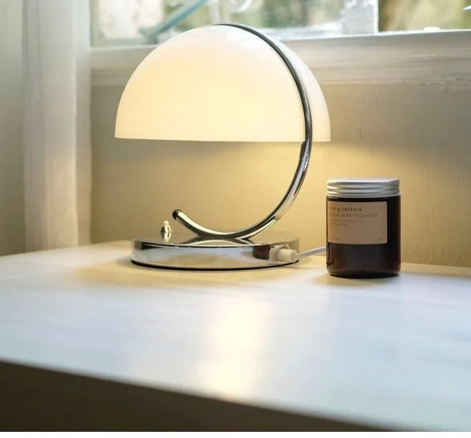Retro space age LED table lamp with glass shade in orange or white colour for desk, bedroom, or living room use