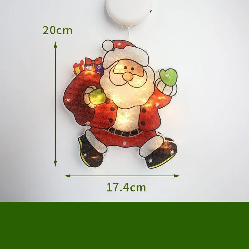 Set of 8 PVC LED Christmas decoration figures including Santa, snowman, reindeer, Christmas tree, train, and more on a windowsill