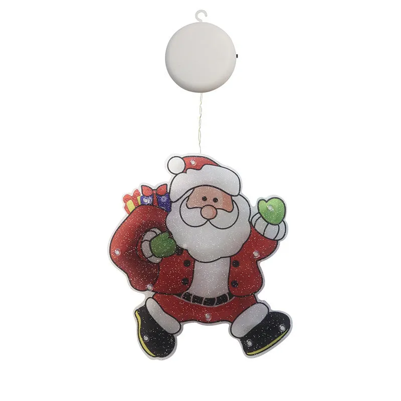Set of 8 PVC LED Christmas decoration figures including Santa, snowman, reindeer, Christmas tree, train, and more on a windowsill