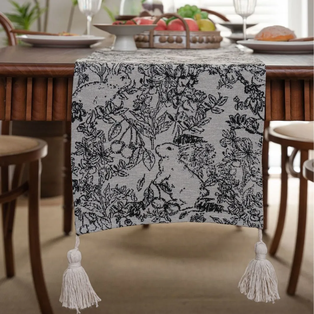 American-style beige jacquard table runner with long tassels and floral pattern on a dining table.