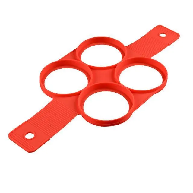 Red silicone nonstick egg pancake maker ring laid flat on a cooking surface