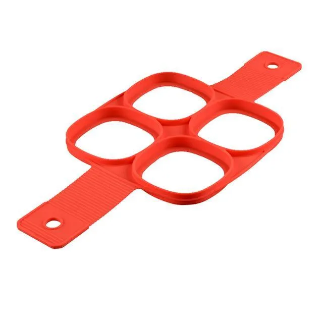 Red silicone nonstick egg pancake maker ring laid flat on a cooking surface