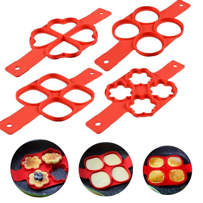 Red silicone nonstick egg pancake maker ring laid flat on a cooking surface