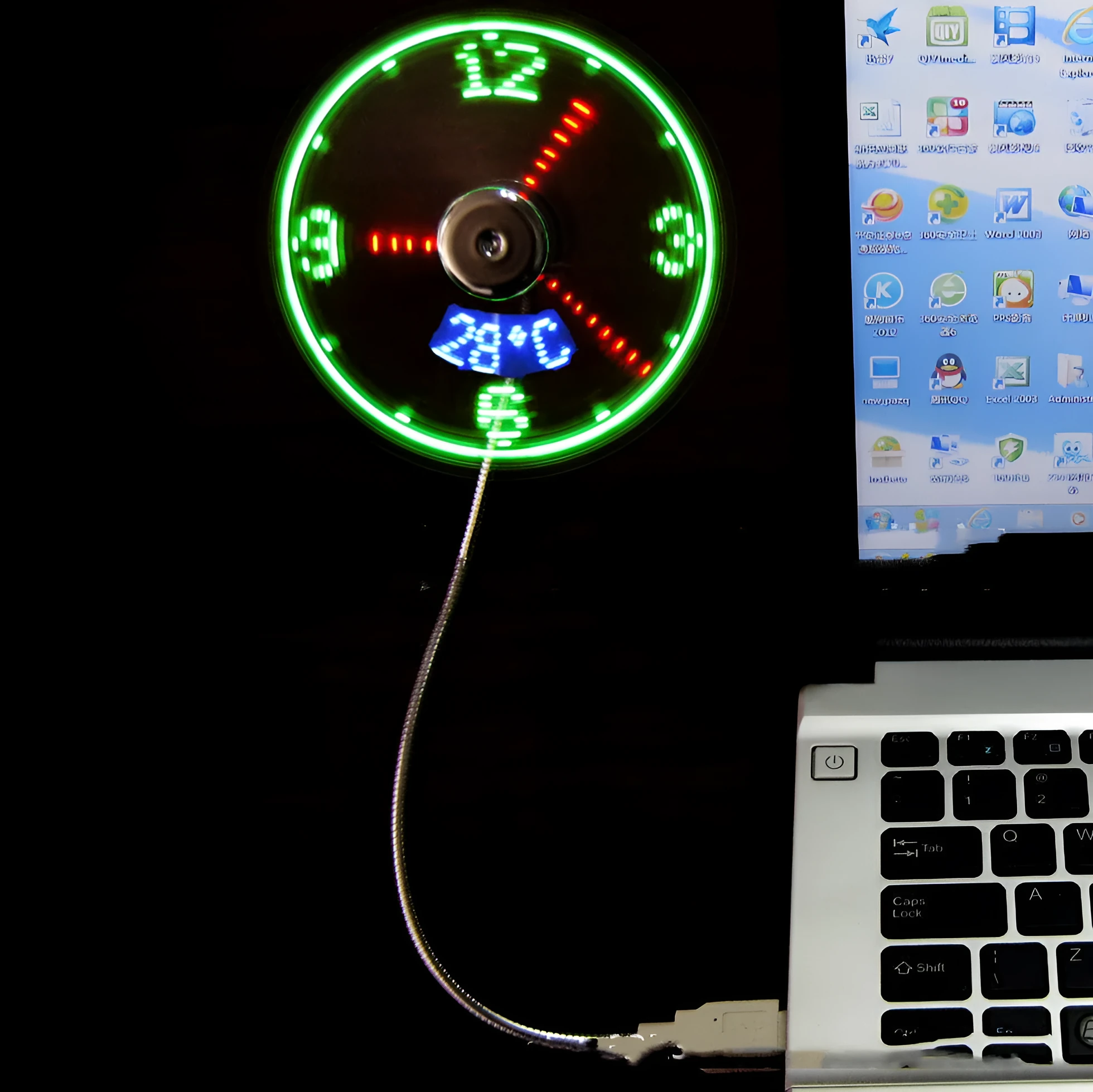 USB clock temperature fan with LED display, soft plastic blades, and flexible silver metal neck on a desk