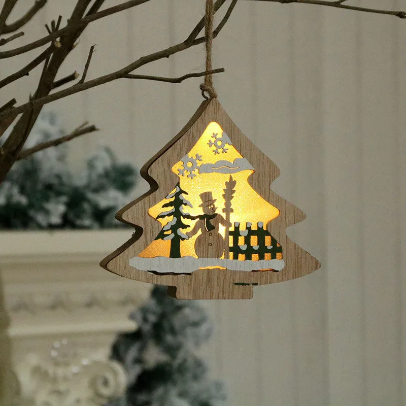 Set of four laser-cut wooden Christmas tree-shaped decorations including old man, snowman, deer, and five-star snowman in polychromatic colours