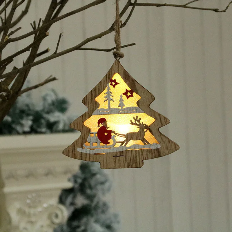 Set of four laser-cut wooden Christmas tree-shaped decorations including old man, snowman, deer, and five-star snowman in polychromatic colours