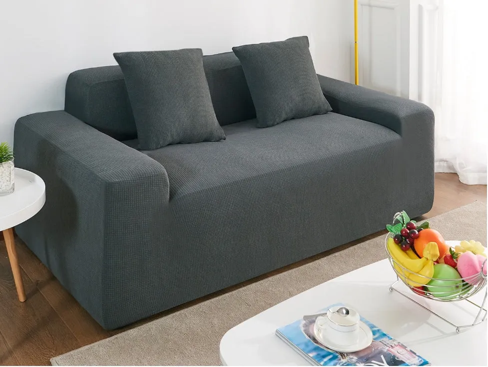 Waterproof polar fleece solid colour sofa slipcover with elastic bottom fitted on a 3-seat sofa in beige colour