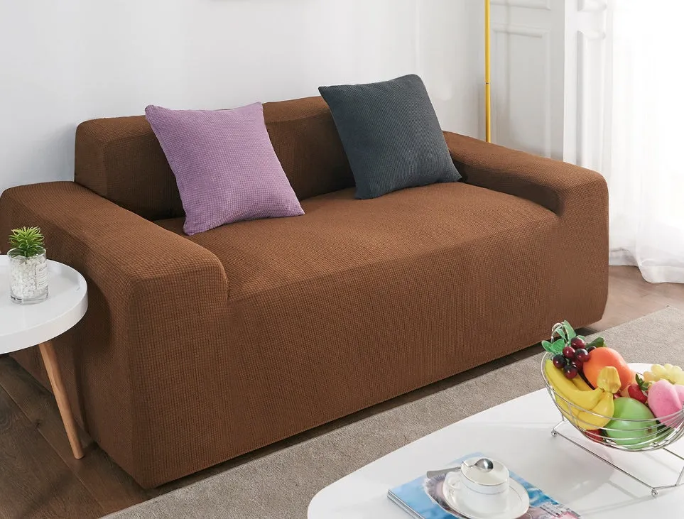 Waterproof polar fleece solid colour sofa slipcover with elastic bottom fitted on a 3-seat sofa in beige colour