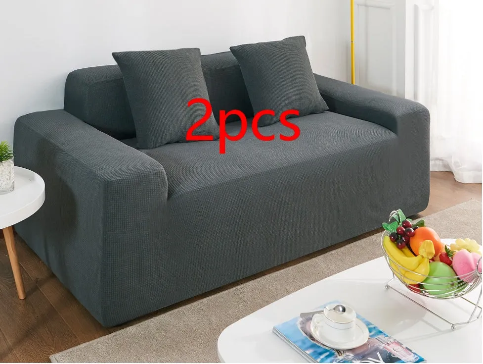 Waterproof polar fleece solid colour sofa slipcover with elastic bottom fitted on a 3-seat sofa in beige colour