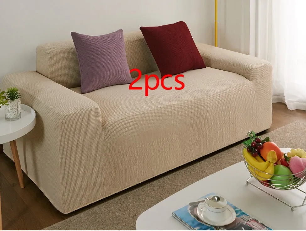 Waterproof polar fleece solid colour sofa slipcover with elastic bottom fitted on a 3-seat sofa in beige colour