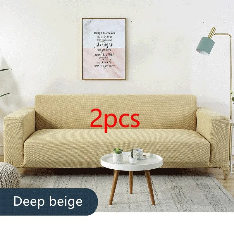 Waterproof polar fleece solid colour sofa slipcover with elastic bottom fitted on a 3-seat sofa in beige colour