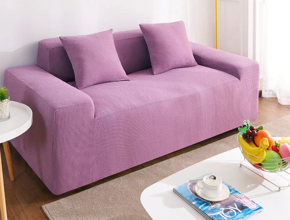 Waterproof polar fleece solid colour sofa slipcover with elastic bottom fitted on a 3-seat sofa in beige colour