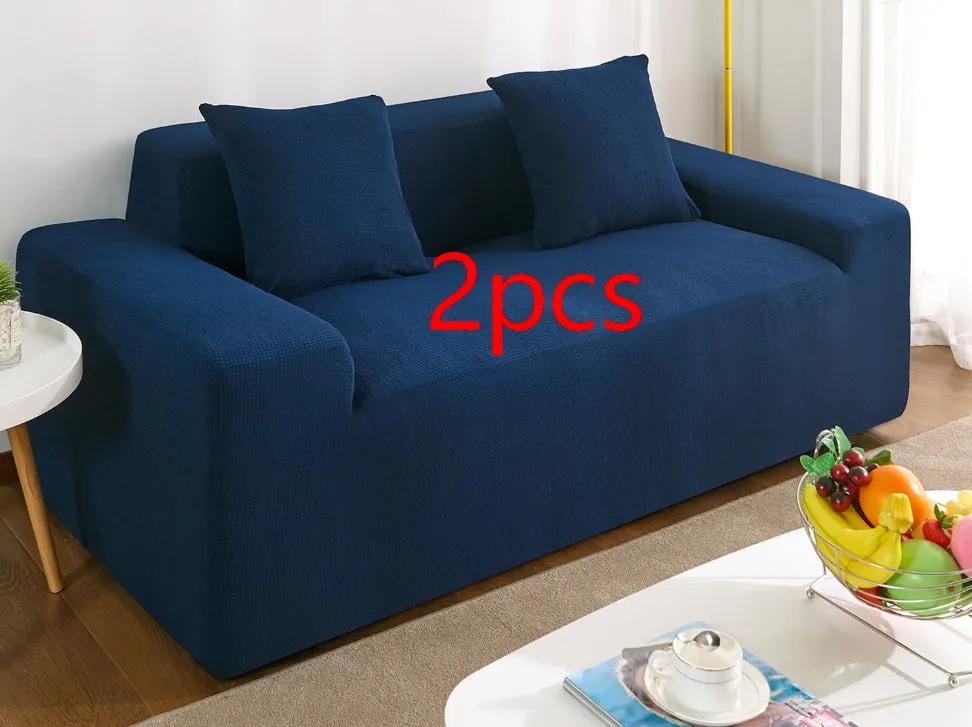 Waterproof polar fleece solid colour sofa slipcover with elastic bottom fitted on a 3-seat sofa in beige colour