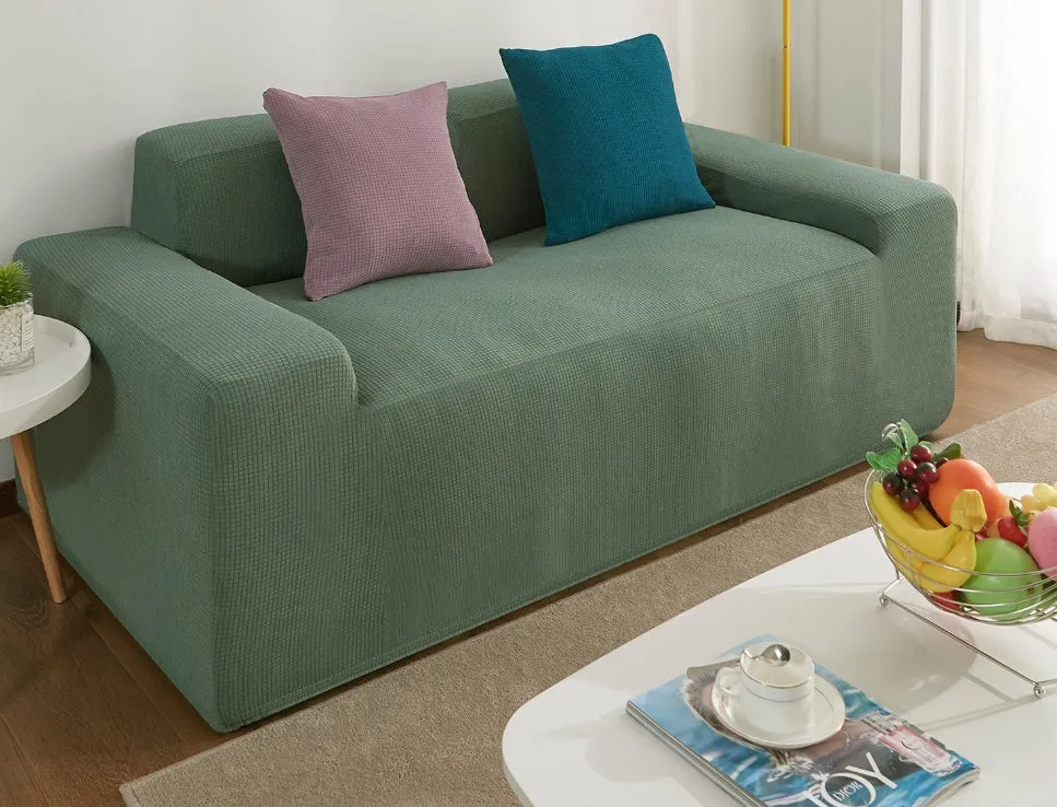 Waterproof polar fleece solid colour sofa slipcover with elastic bottom fitted on a 3-seat sofa in beige colour
