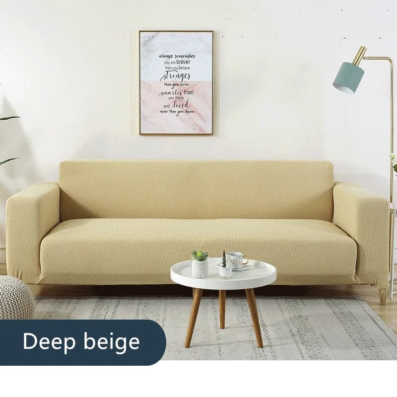 Waterproof polar fleece solid colour sofa slipcover with elastic bottom fitted on a 3-seat sofa in beige colour