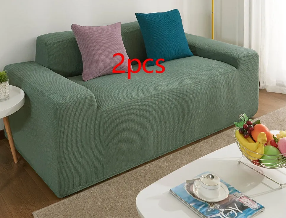Waterproof polar fleece solid colour sofa slipcover with elastic bottom fitted on a 3-seat sofa in beige colour