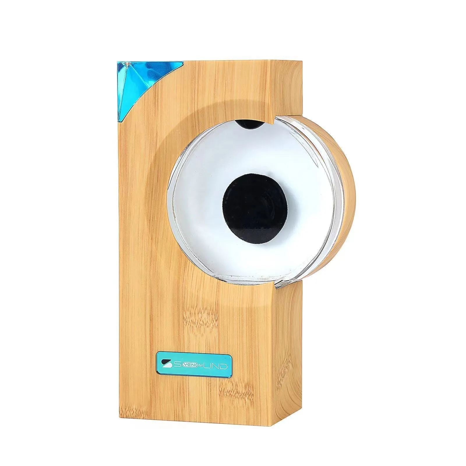 Dancing ferrofluid speaker in gray plastic casing with warm white light showing magnetic fluid shapes