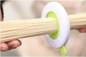 Plastic pasta noodle thickness selector tool with rotating dial, 8x9x1cm