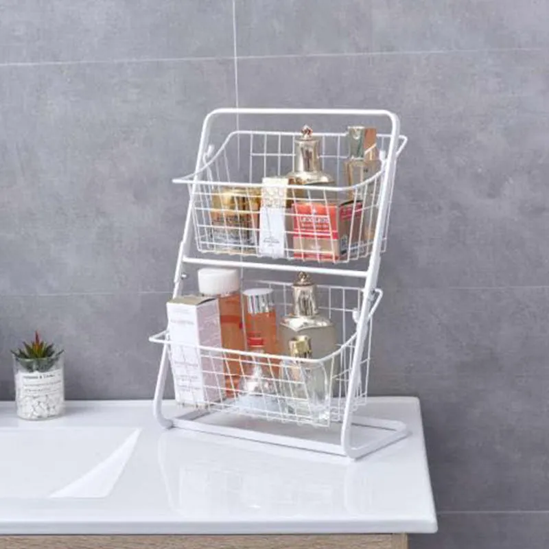 Two-tier black stainless steel kitchen storage rack with fruit and vegetables on a countertop